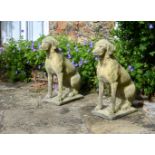 A PAIR OF STONE COMPOSITION MODELS OF HOUNDS 20TH CENTURY