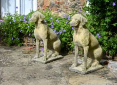 A PAIR OF STONE COMPOSITION MODELS OF HOUNDS 20TH CENTURY