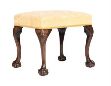 A MAHOGANY AND UPHOLSTERED STOOL IN GEORGE III STYLE