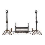 A PAIR OF WROUGHT IRON ANDIRONS IN ARTS AND CRAFTS STYLE