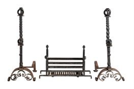 A PAIR OF WROUGHT IRON ANDIRONS IN ARTS AND CRAFTS STYLE