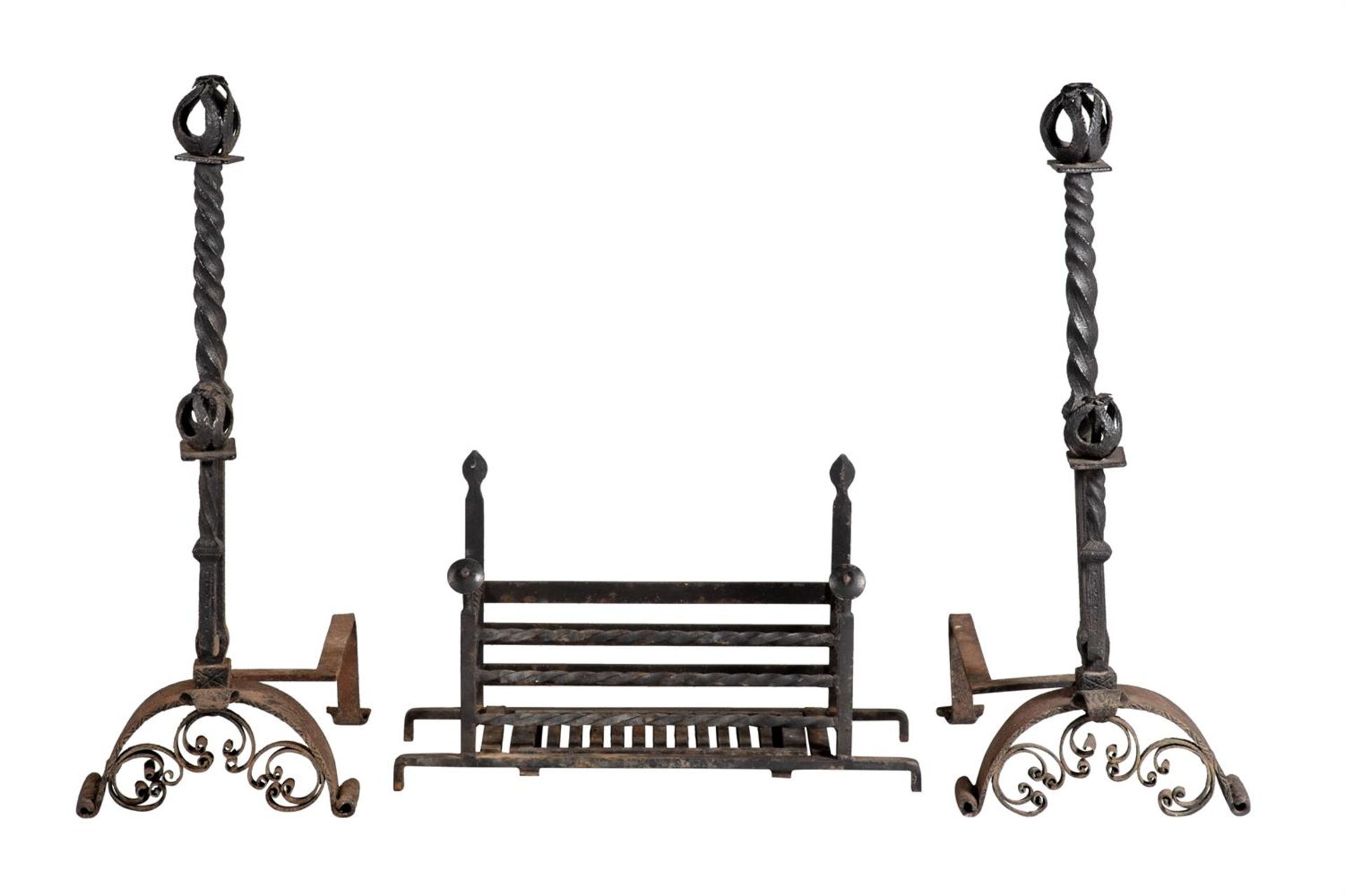 A PAIR OF WROUGHT IRON ANDIRONS IN ARTS AND CRAFTS STYLE