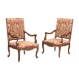A PAIR OF FRENCH WALNUT AND NEEDLEWORK UPHOLSTERED CHAIRS IN EARLY 18TH CENTURY TASTE
