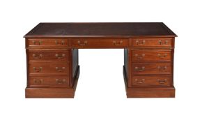 A MAHOGANY AND TOOLED LEATHER TWIN PEDESTAL PARTNER'S DESK