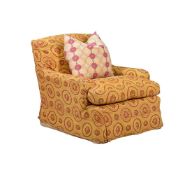 AN UPHOLSTERED EASY ARMCHAIR