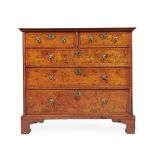 A FIGURED WALNUT, WALNUT AND LINE INLAID CHEST OF DRAWERS