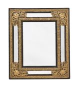 AN EBONISED AND GILT METAL MOUNTED WALL MIRROR