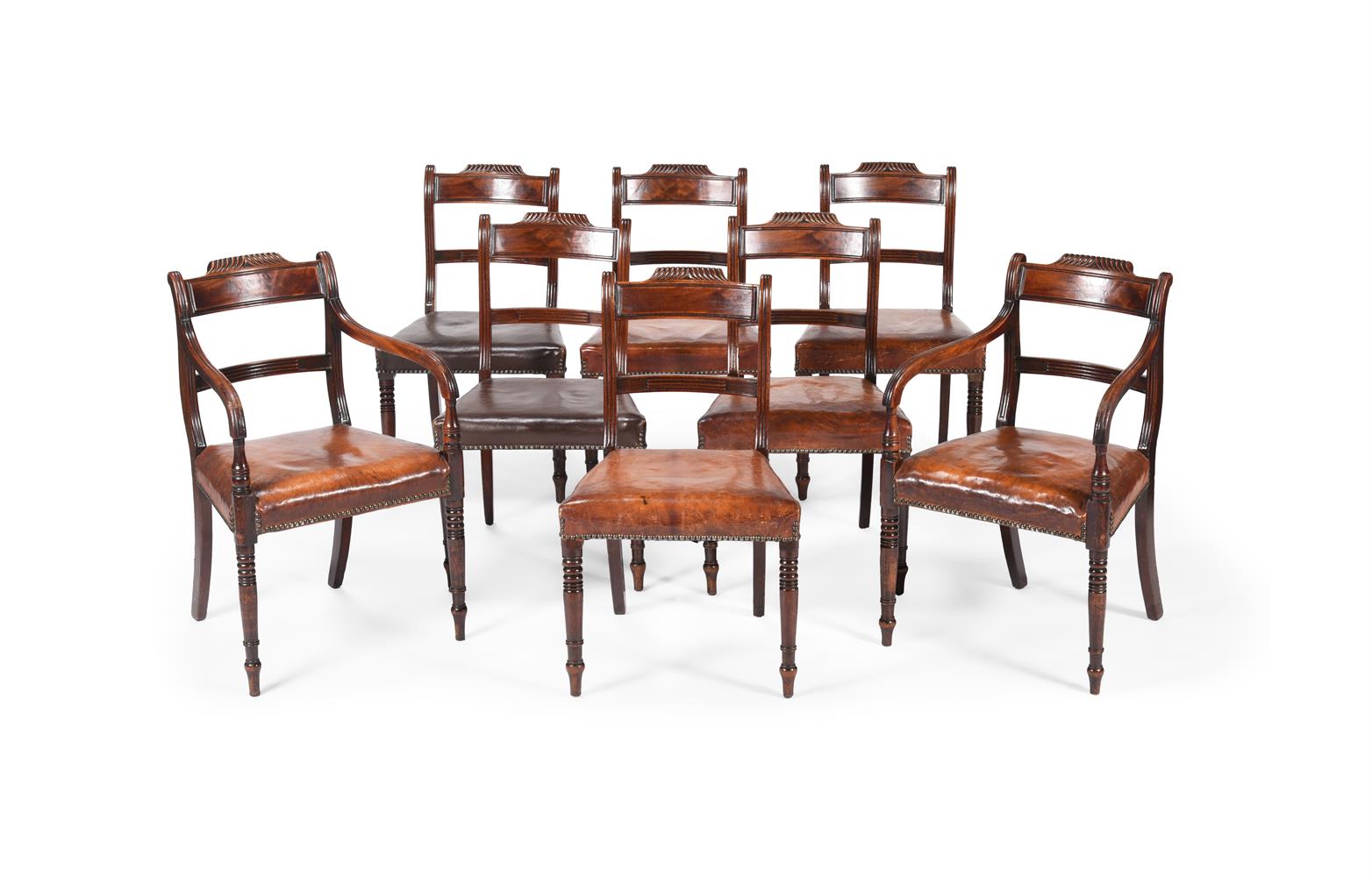 A SET OF EIGHT GEORGE IV MAHOGANY AND LEATHER UPHOLSTERED DINING CHAIRS