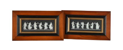 A PAIR OF WEDGWOOD BLACK JASPER FRAMED AND GLAZED PLAQUES