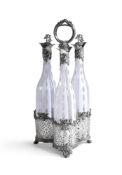 AN ENGLISH CLEAR AND OPAQUE WHITE OVERLAY GLASS DECANTER SET OF THREE BOTTLES AND STOPPERS