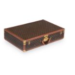 LOUIS VUITTON, A MONOGRAMMED COATED CANVAS HARD SUITCASE