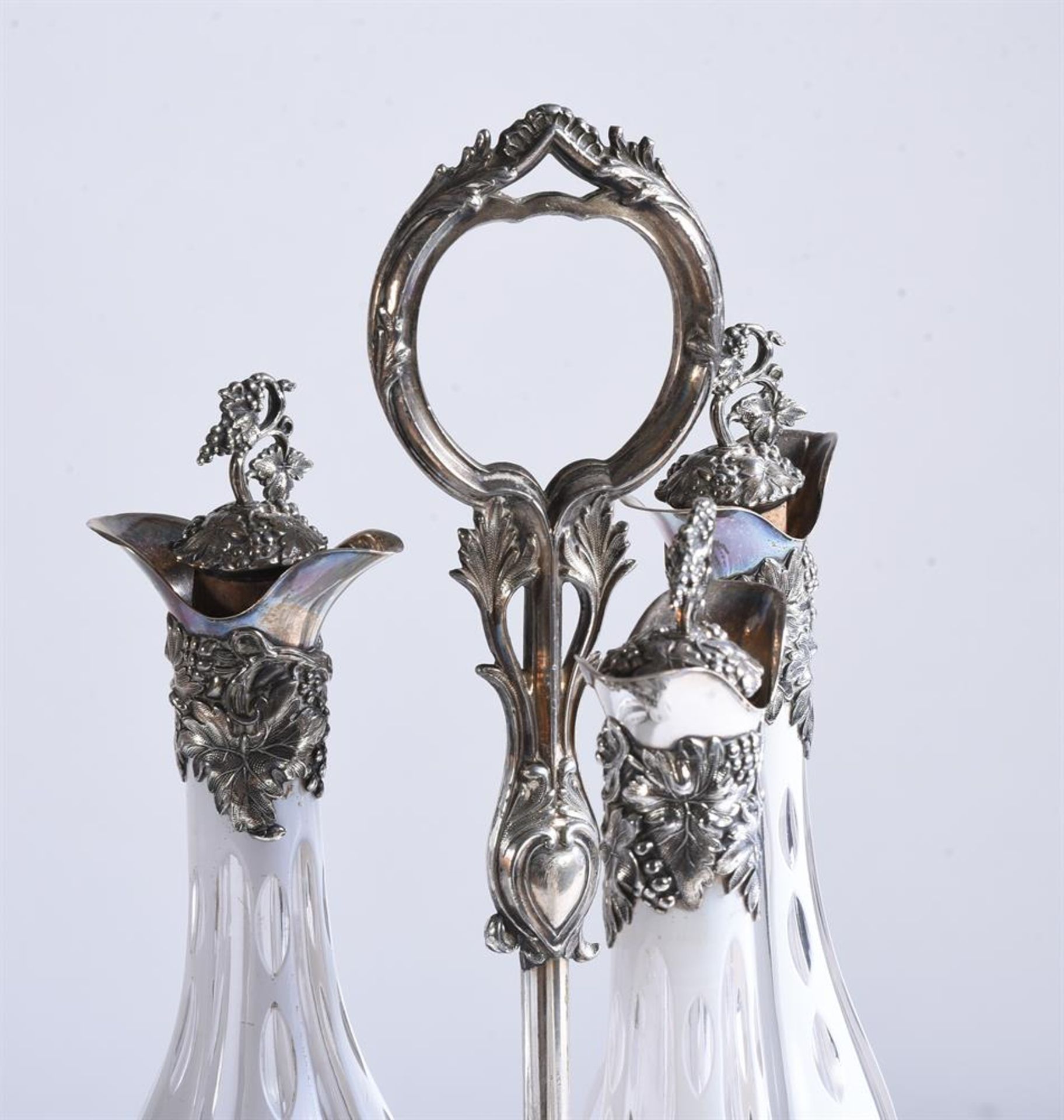 AN ENGLISH CLEAR AND OPAQUE WHITE OVERLAY GLASS DECANTER SET OF THREE BOTTLES AND STOPPERS - Image 3 of 3