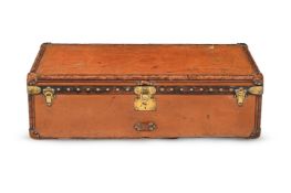 LOUIS VUITTON, A BROWN LEATHER HARD SUITCASE