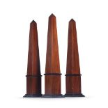 THREE MAHOGANY AND EBONISED OBELISKS BY ANOUSKA HEMPEL