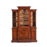 A VICTORIAN MAHOGANY BREAKFRONT BOOKCASE, CIRCA 1880