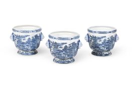 A SET OF THREE CHINESE BLUE AND WHITE JARDINIÈRES WITH LION MASKS