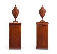 A PAIR OF MAHOGANY PEDESTAL CABINETS AND A PAIR OF URN SHAPED KNIFE BOXES19TH CENTURY AND LATERthe