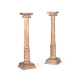 A PAIR OF CARVED PINE COLUMNAR PEDESTALS 20TH CENTURY