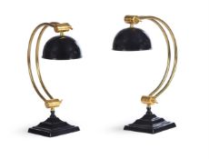A PAIR OF BLACK AND GILT METAL ADJUSTABLE LAMPS, IN ART DECO STYLE