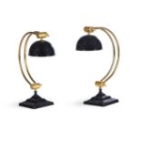 A PAIR OF BLACK AND GILT METAL ADJUSTABLE LAMPS, IN ART DECO STYLE