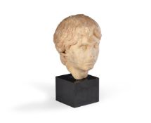 A CARVED MARBLE PORTRAIT HEAD OF A YOUTH