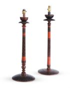 TWO INDIAN RED AND BLACK DECORATED TURNED WOOD TABLE LAMPS, FIRST HALF 20TH CENTURY