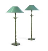 A PAIR OF GREEN PAINTED STANDARD LAMPSFIRST HALF 20TH CENTURYwith green lacquered shadesthe lamps