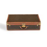 LOUIS VUITTON, A MONOGRAMMED COATED CANVAS HARD SUITCASE