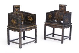 A PAIR OF CHINESE BLACK AND GILT ARMCHAIRS, 20TH CENTURY