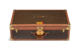 LOUIS VUITTON, A MONOGRAMMED COATED CANVAS HARD SUITCASE
