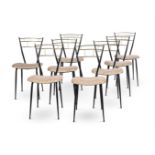 A SET OF EIGHT TUBULAR METAL BLACK AND BRASS CHAIRS BY ANOUSKA HEMPEL