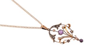 AN EDWARDIAN AMETHYST AND SEED PEARL PENDANT ON CHAIN, CIRCA 1910