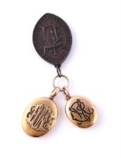 TWO VICTORIAN GOLD LOCKETS AND A COMMEMORATIVE MEDALLION