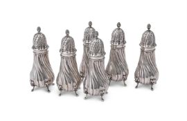 A MATCHED SET OF SIX CONTINENTAL SILVER COLOURED SUGAR CASTERS