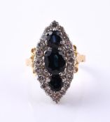 A SAPPHIRE AND DIAMOND MARQUISE CLUSTER RING