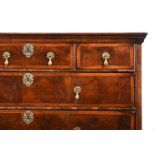 A QUEEN ANNE FIGURED WALNUT CHEST OF DRAWERS, CIRCA 1710