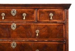 A QUEEN ANNE FIGURED WALNUT CHEST OF DRAWERS, CIRCA 1710