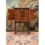 A FINE CHARLES II OLIVEWOOD OYSTER-VENEERED, WALNUT AND FRUITWOOD CROSSBANDED CABINET ON STAND