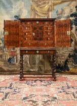 A FINE CHARLES II OLIVEWOOD OYSTER-VENEERED, WALNUT AND FRUITWOOD CROSSBANDED CABINET ON STAND