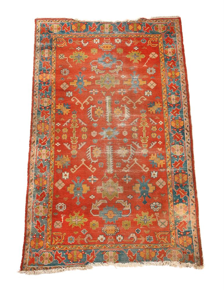 AN USHAK RUG, approximately 221 x 127cm