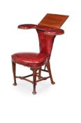 Y A MAHOGANY AND LEATHER UPHOLSTERED READING CHAIR, IN GEORGE II STYLE