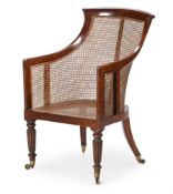 A GEORGE IV SIMULATED ROSEWOOD LIBRARY BERGERE ARMCHAIR, IN THE MANNER OF GILLOWS, CIRCA 1825
