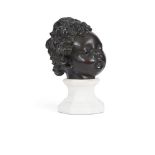 A BAROQUE BRONZE HEAD OF A CHILD ITALIAN, PROBABLY 17TH OR 18TH CENTURY