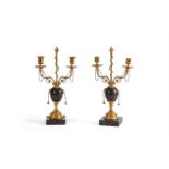 A PAIR OF SWEDISH ORMOLU AND PORPHYRY 'RANNAS' TWIN-BRANCH CANDELABRA, CIRCA 1800