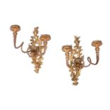 A PAIR OF CARVED GILTWOOD TWIN LIGHT WALL APPLIQUES, MID 18TH CENTURY