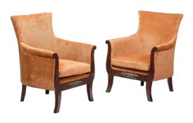 A PAIR OF SIMULATED ROSEWOOD, BRASS MOUNTED, AND UPHOLSTERED LIBRARY ARMCHAIRS, IN REGENCY STYLE