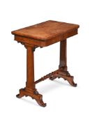 A REGENCY FIGURED OAK AND OAK FOLDING GAMES OR WRITING TABLE, IN THE MANNER OF GEORGE BULLOCK