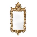 A GEORGE III GILTWOOD CARVED WALL MIRROR, CIRCA 1760