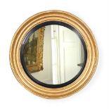 A REGENCY GILTWOOD CONVEX MIRROR, CIRCA 1815