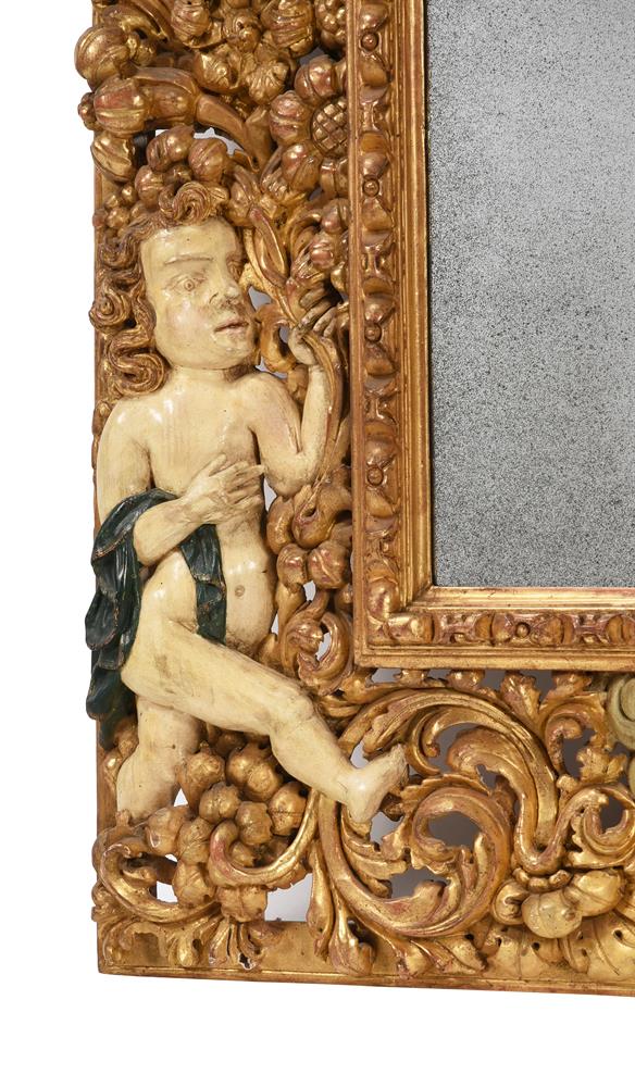 A CONTINENTAL CARVED GILTWOOD AND PAINTED MIRROR, SOUTH GERMAN OR AUSTRIAN, 17TH CENTURY AND LATER - Image 4 of 6